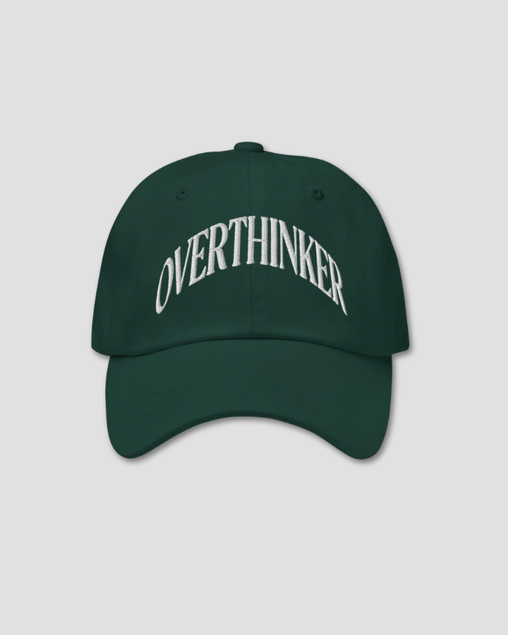 Green cap with 'OVERTHINKER' text on a light gray background