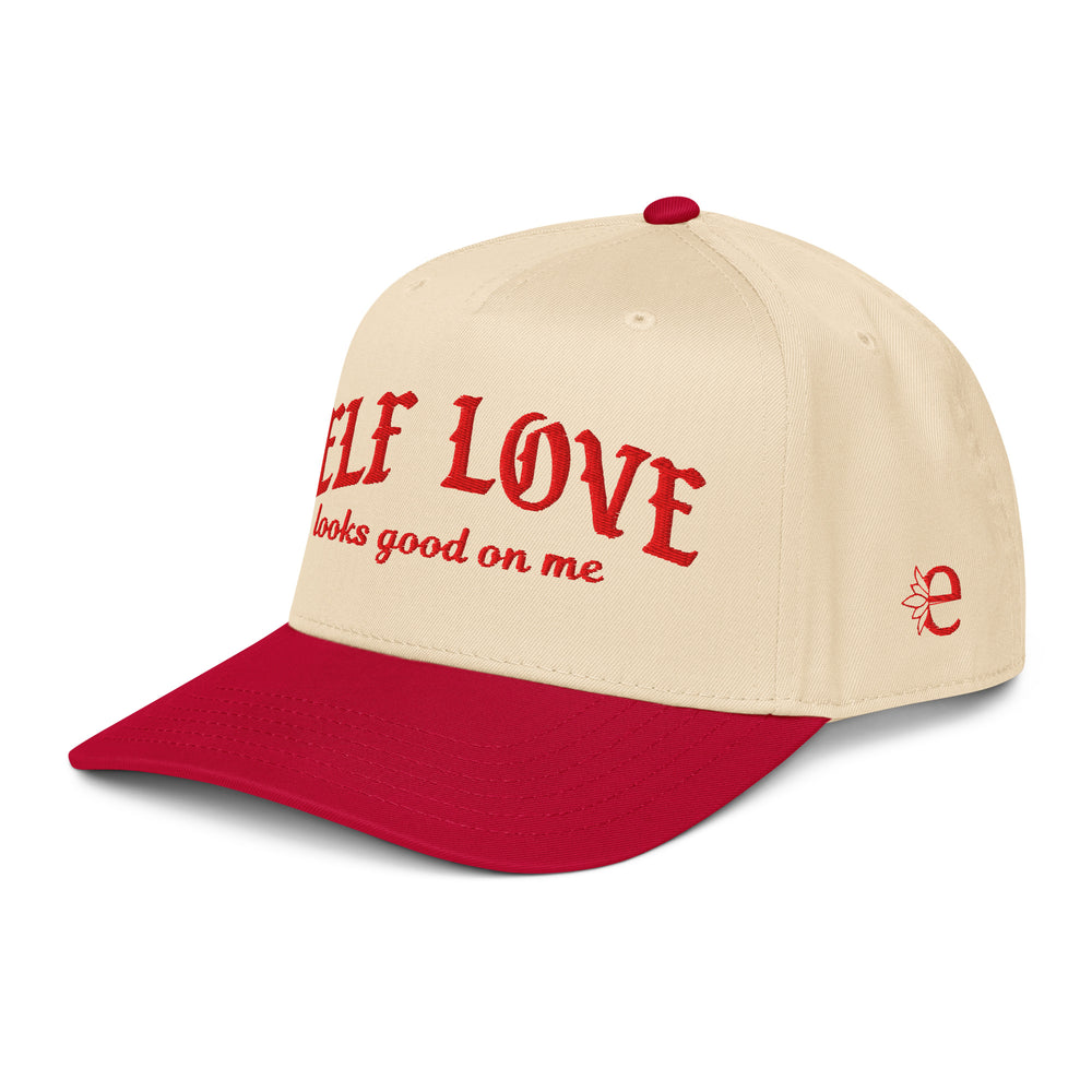 Beige and red cap with 'Self Love looks good on me' text on a white background