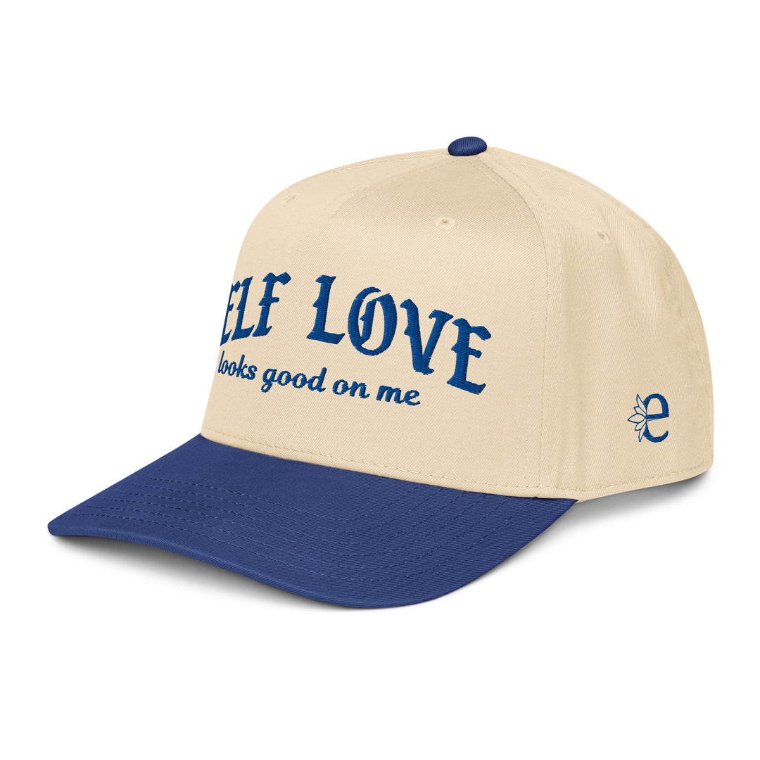Beige and blue cap with 'Self Love looks good on me' text on a white background