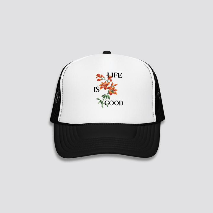 Trucker hat with floral design and 'Life is Good' text on a white background