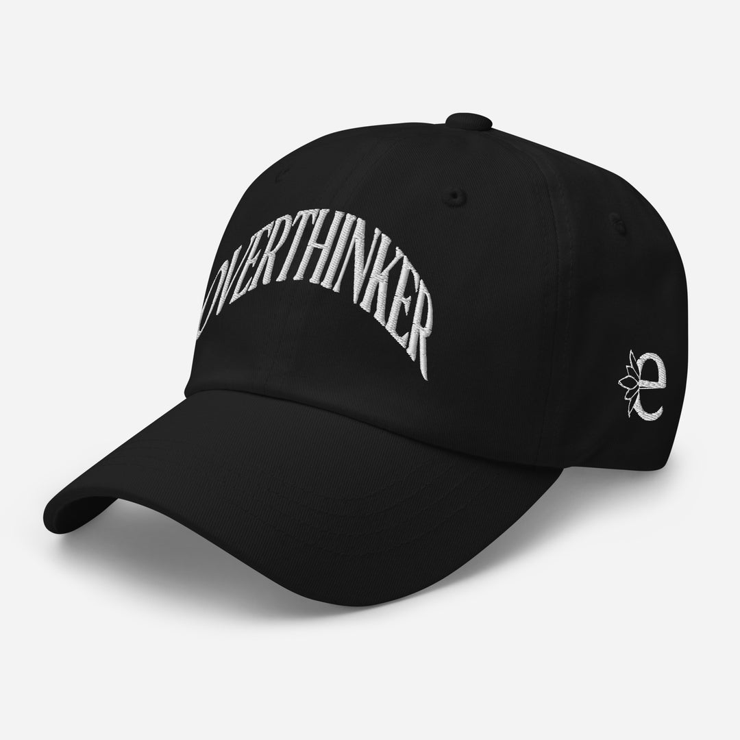 Black cap with 'OVERTHINKER' text on a light gray background
