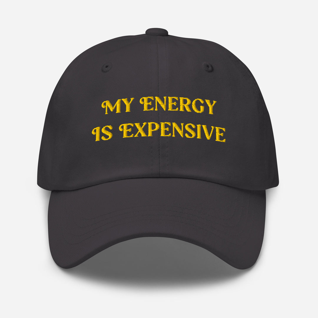 Black cap with yellow text 'MY ENERGY IS EXPENSIVE' on a white background