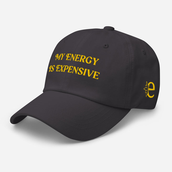 Black cap with yellow text and logo on a light gray background