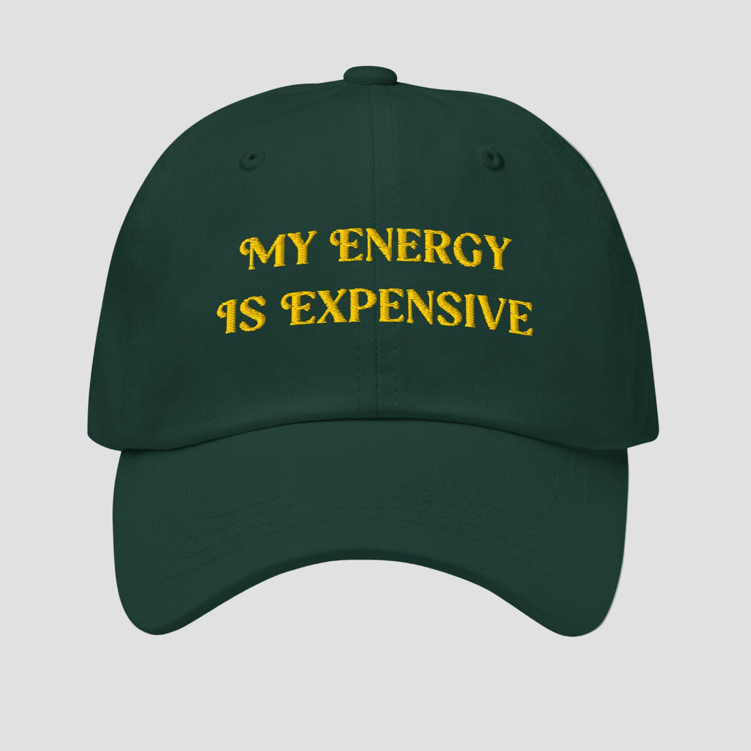 Green cap with 'MY ENERGY IS EXPENSIVE' text in yellow on a white background