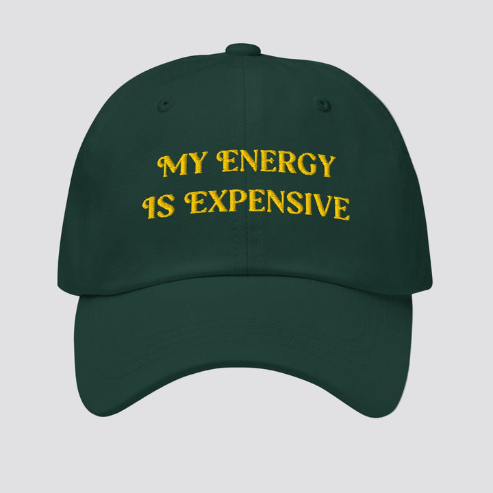 Green cap with 'MY ENERGY IS EXPENSIVE' text in yellow on a white background
