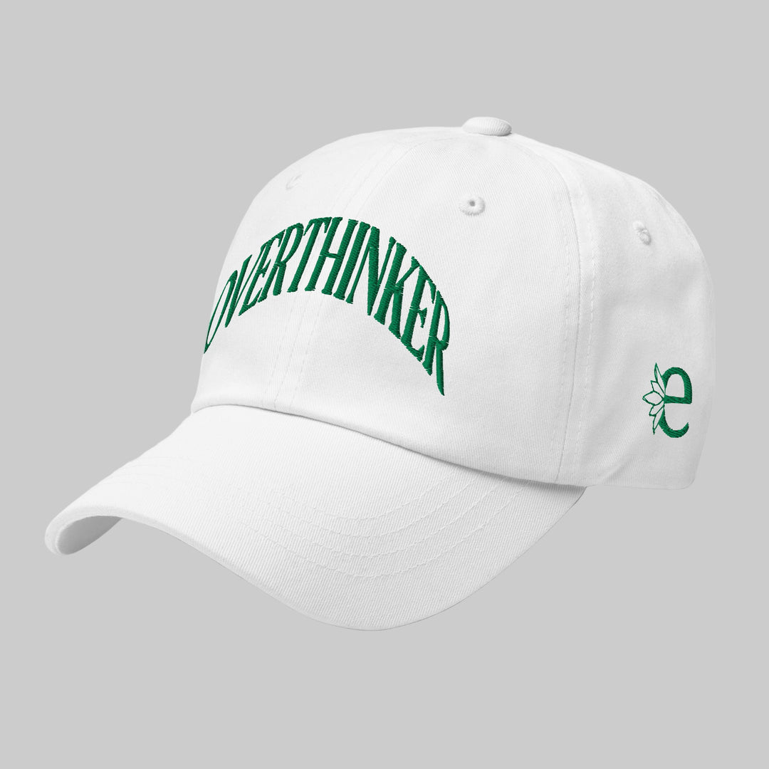 White cap with green text and logo on a white background