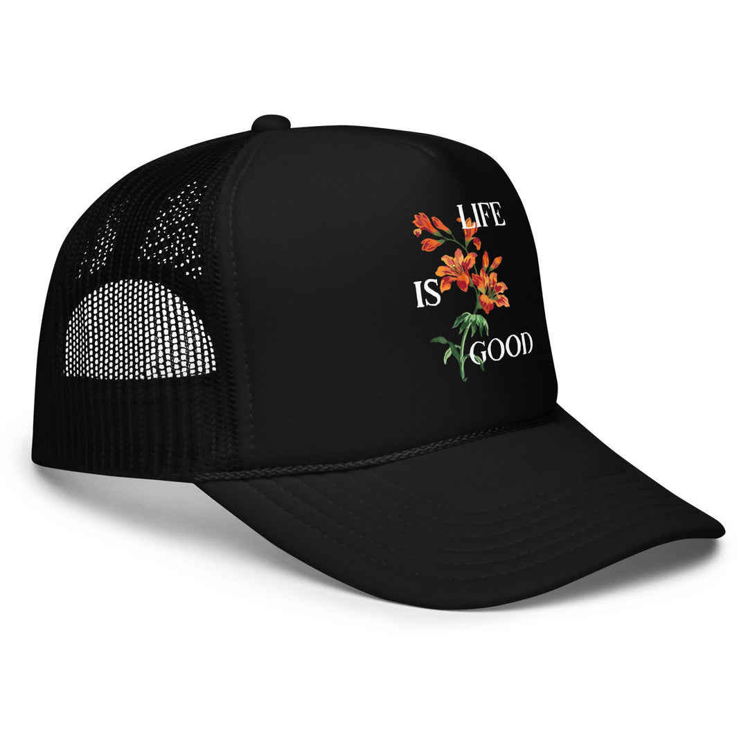 Black cap with floral design and 'Life is Good' text on a white background