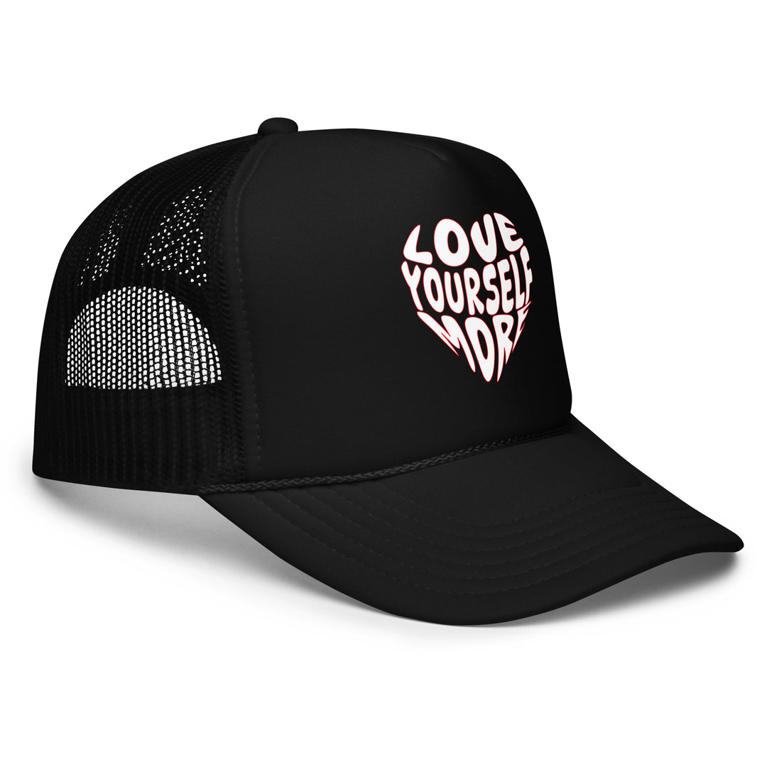 Black trucker cap with 'Love Yourself More' text on a white background
