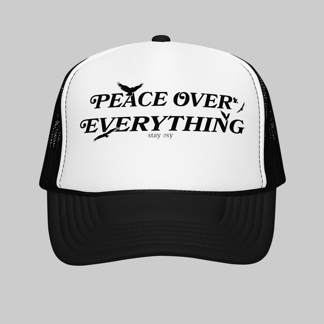 Black and white cap with 'Peace Over Everything' text on a white background