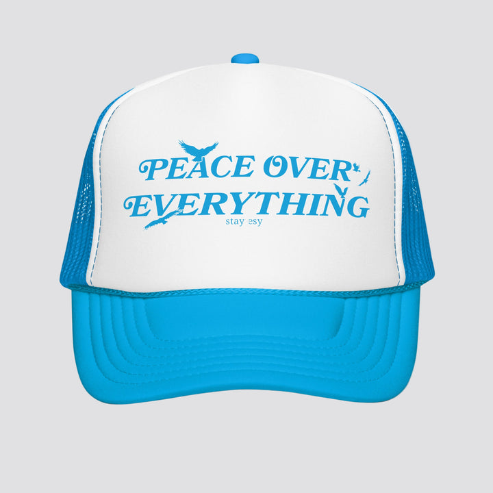 Blue and white cap with 'Peace Over Everything' text on a white background
