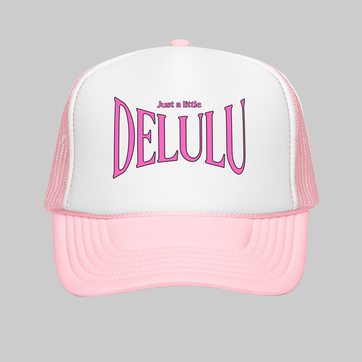 Pink and white cap with 'Just a little DELULU' text on a white background