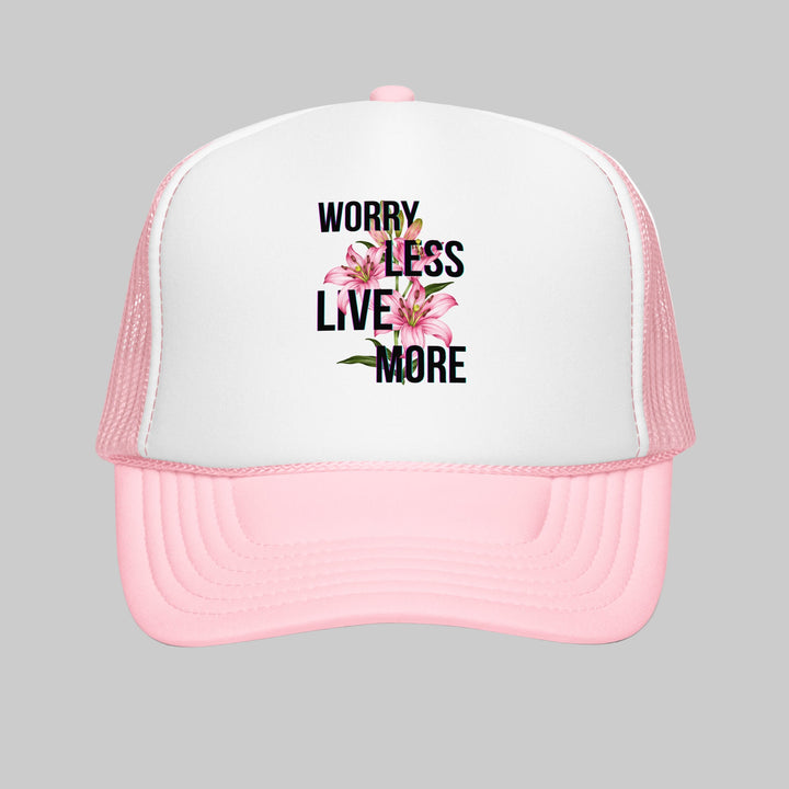 Pink and white trucker hat with floral design and text on a white background