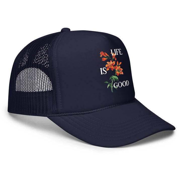 Navy blue cap with floral design and 'Life is Good' text on a white background