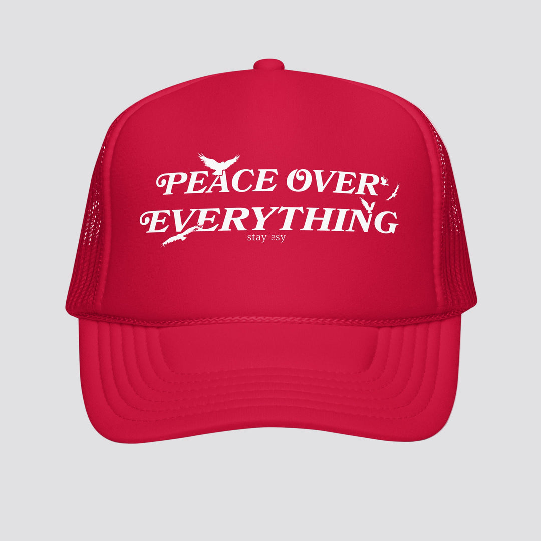 Red cap with 'Peace Over Everything' text on a white background