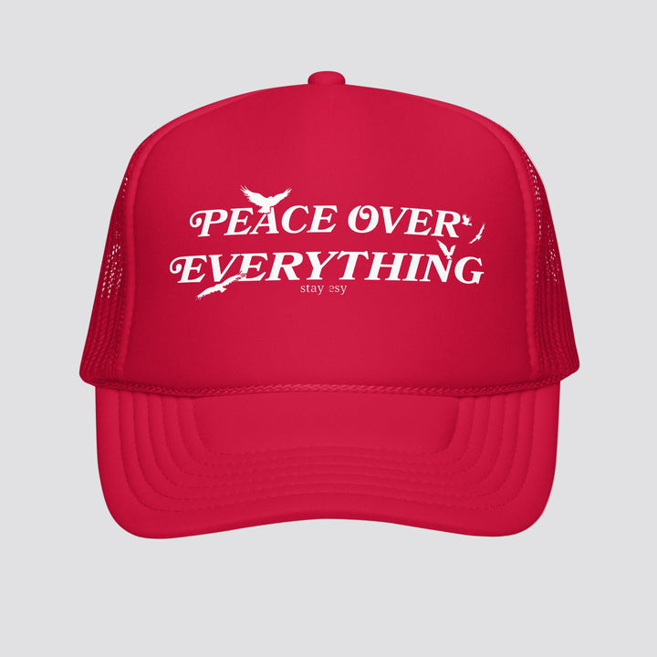 Red cap with 'Peace Over Everything' text on a white background