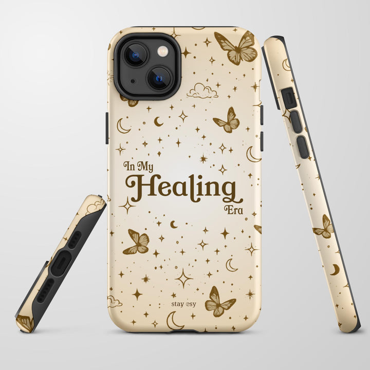 In My Healing Era cream celestial tough iPhone case with golden butterflies, moons and stars by Stay Esy