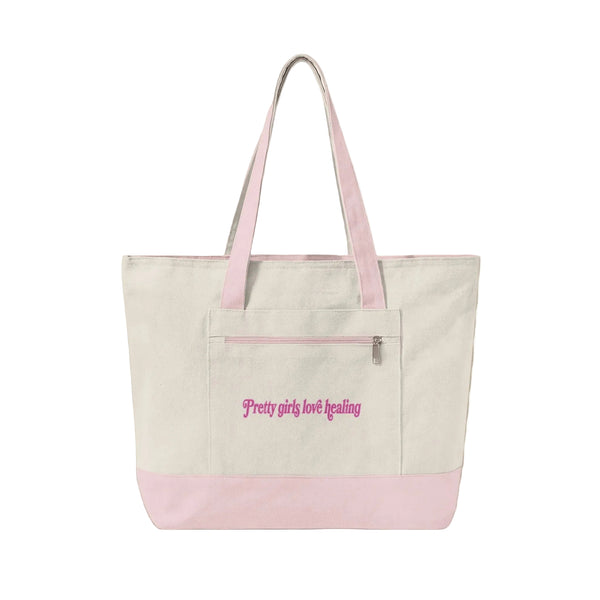 Beige tote bag with pink accents and text on a beige background