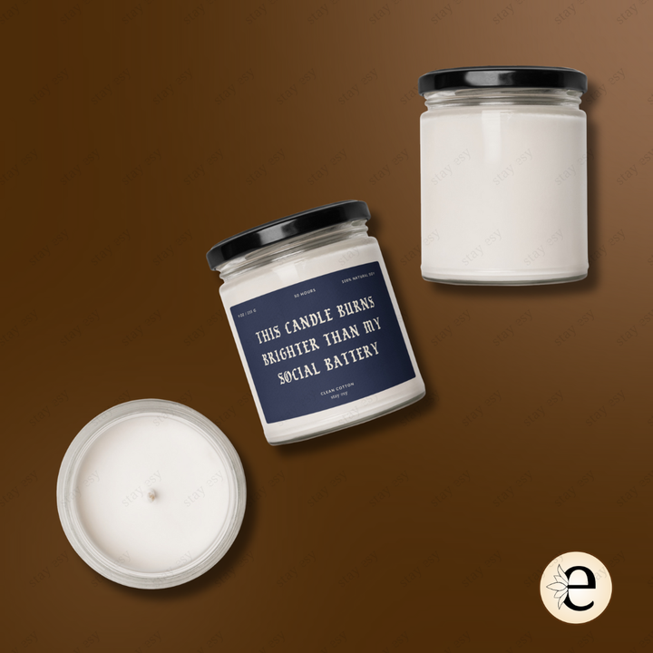 Two jars of candles with a humorous label on a brown background