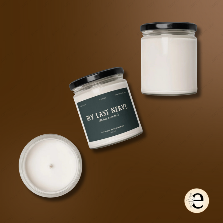 Two candles and a jar labeled 'My Last Nerve' on a brown background