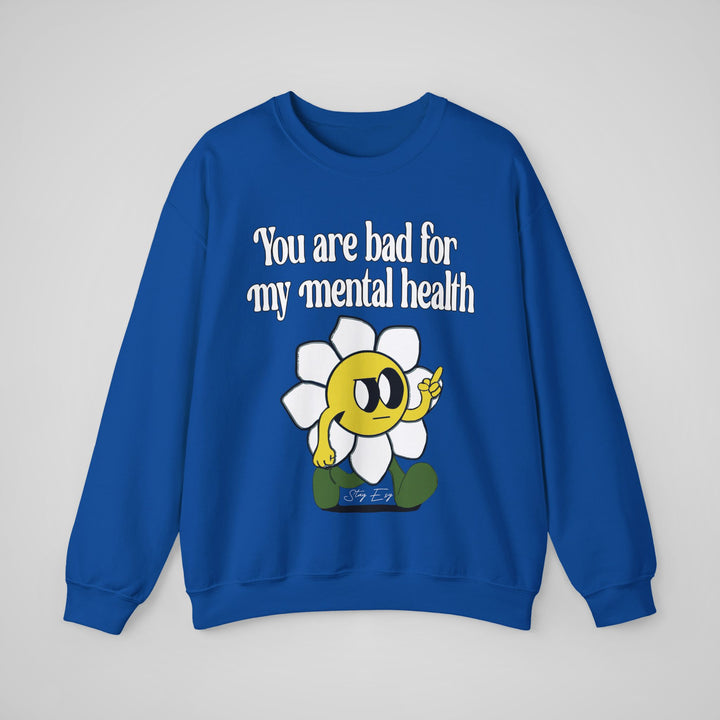 Blue sweatshirt with a cartoon character and text on a gray background