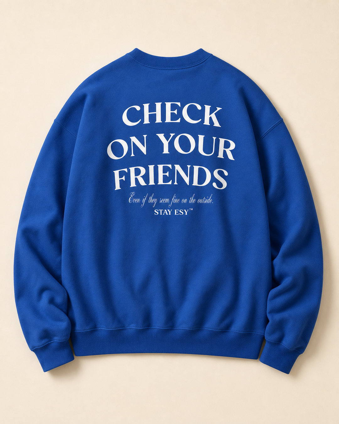 A royal blue crewneck sweatshirt shown from the back, featuring the white printed text &