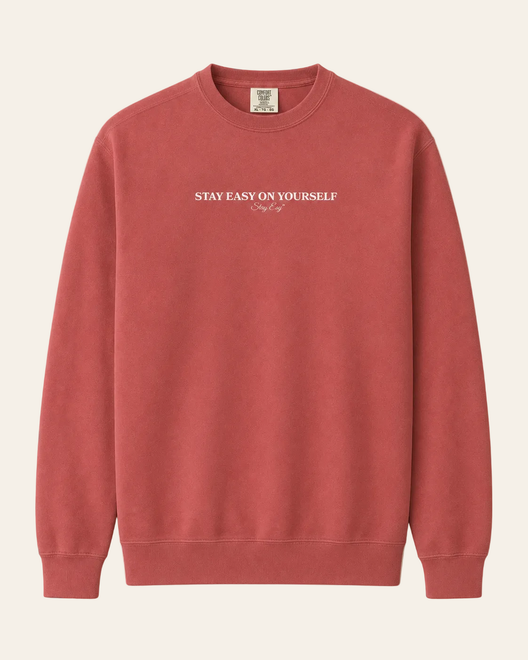 Crimson Unisex Comfort Colors Sweatshirt with stay easy on yourself text on the front.