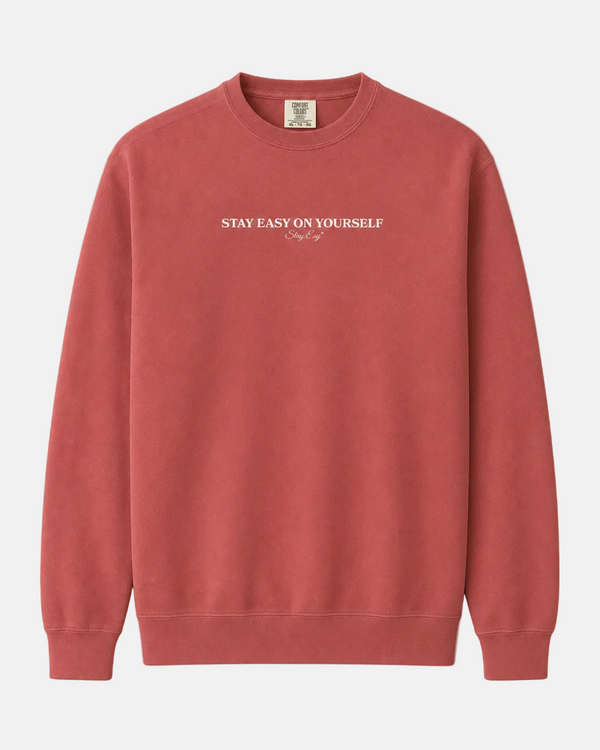 Crimson Unisex Comfort Colors Sweatshirt with stay easy on yourself text on the front.