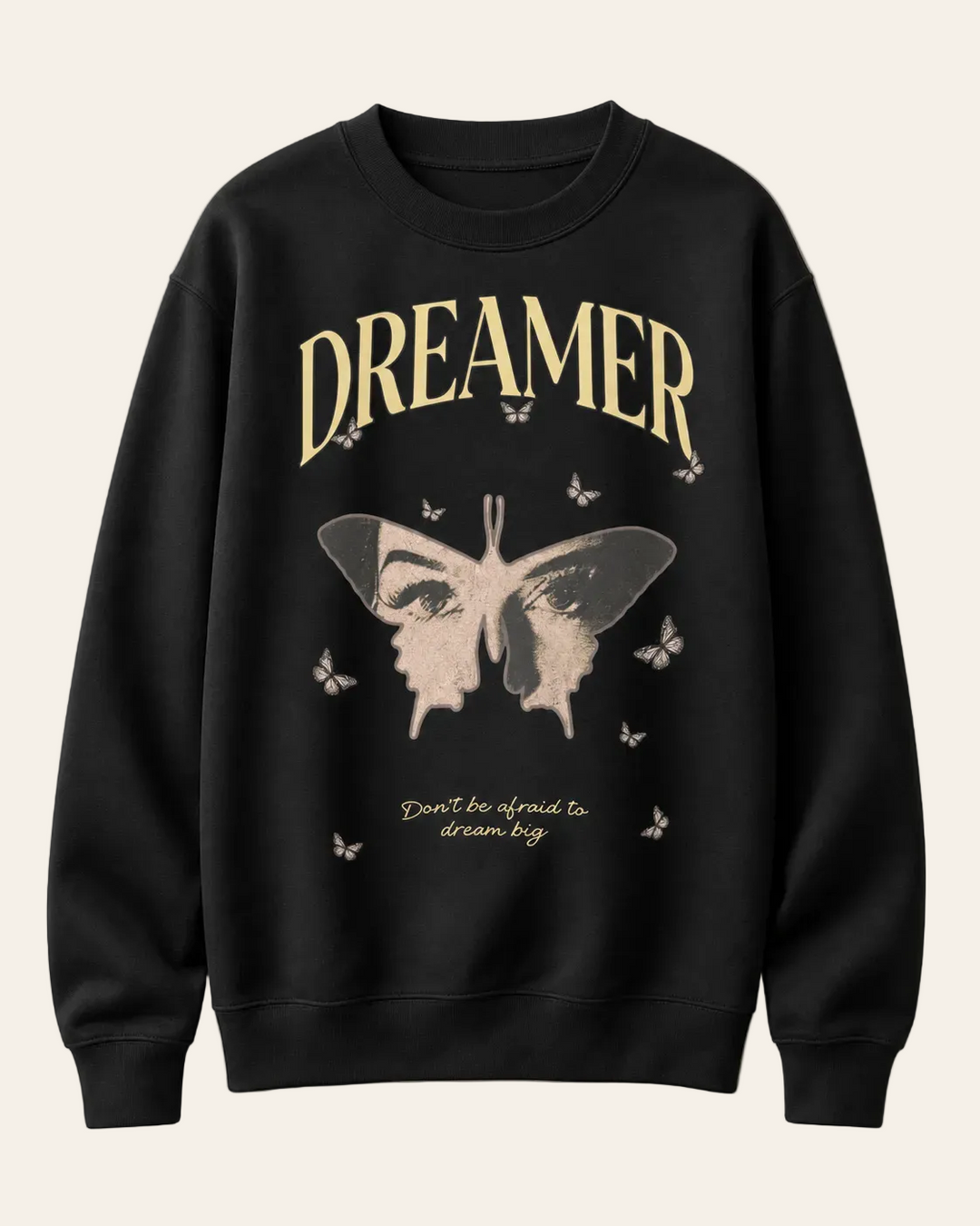 Black sweatshirt with butterfly graphic and 'Dreamer' text on a beige background