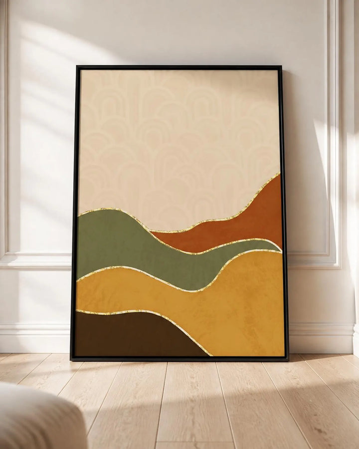 A framed abstract art print with wavy organic shapes in beige, rust orange, sage green, mustard yellow, and dark brown, leaning against a white wall on a light wood floor.