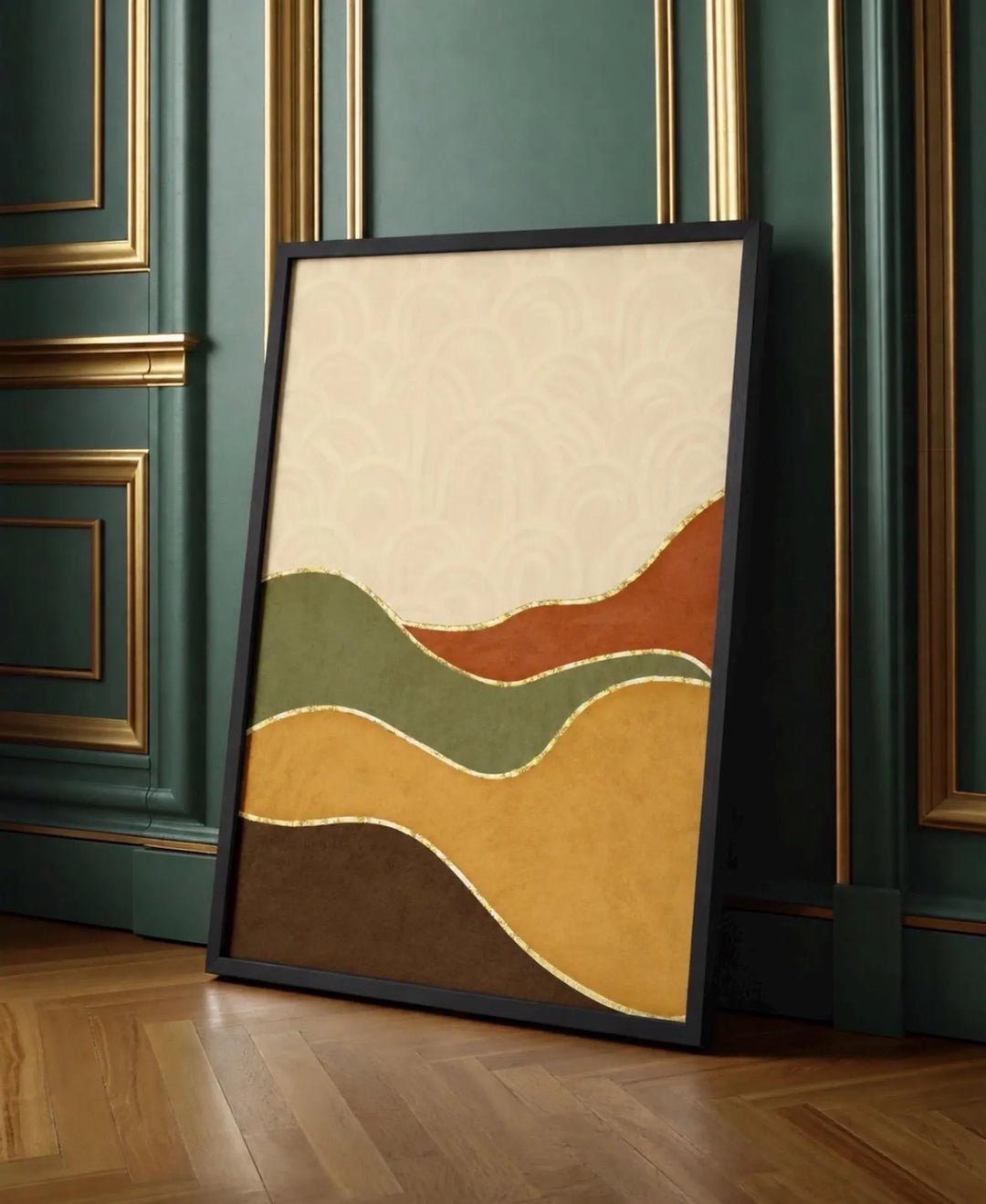 A framed abstract landscape art print with wavy bands of cream, rust, olive green, ochre yellow, and dark brown, leaning against a dark green paneled wall on a wooden floor.