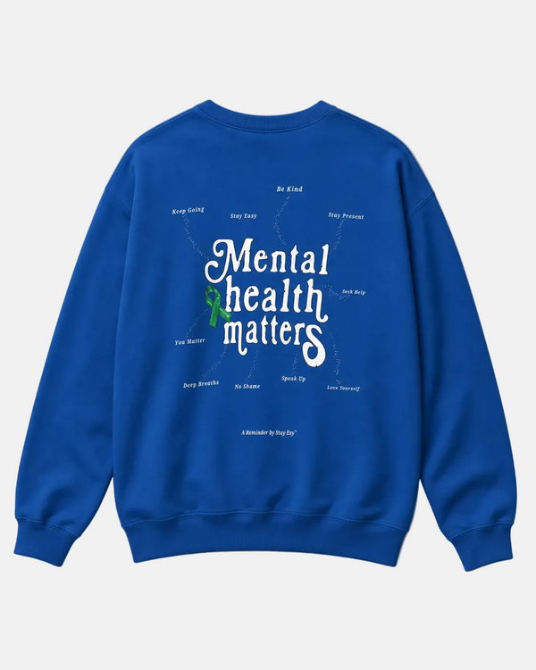 Blue sweatshirt with 'Mental health matters' text on a beige background