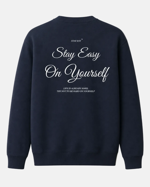 Navy blue sweatshirt with white text on a beige background
