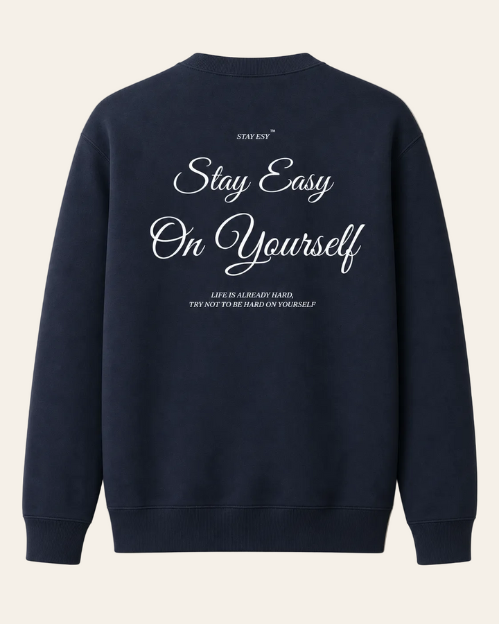 Navy blue sweatshirt with white text on a beige background