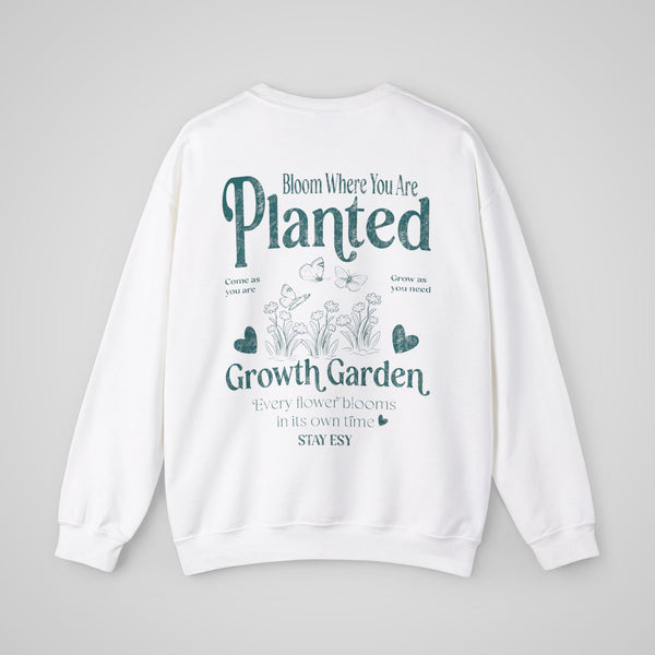 White graphic crewneck sweatshirt – Back view featuring a Bloom Where You Are Planted design.