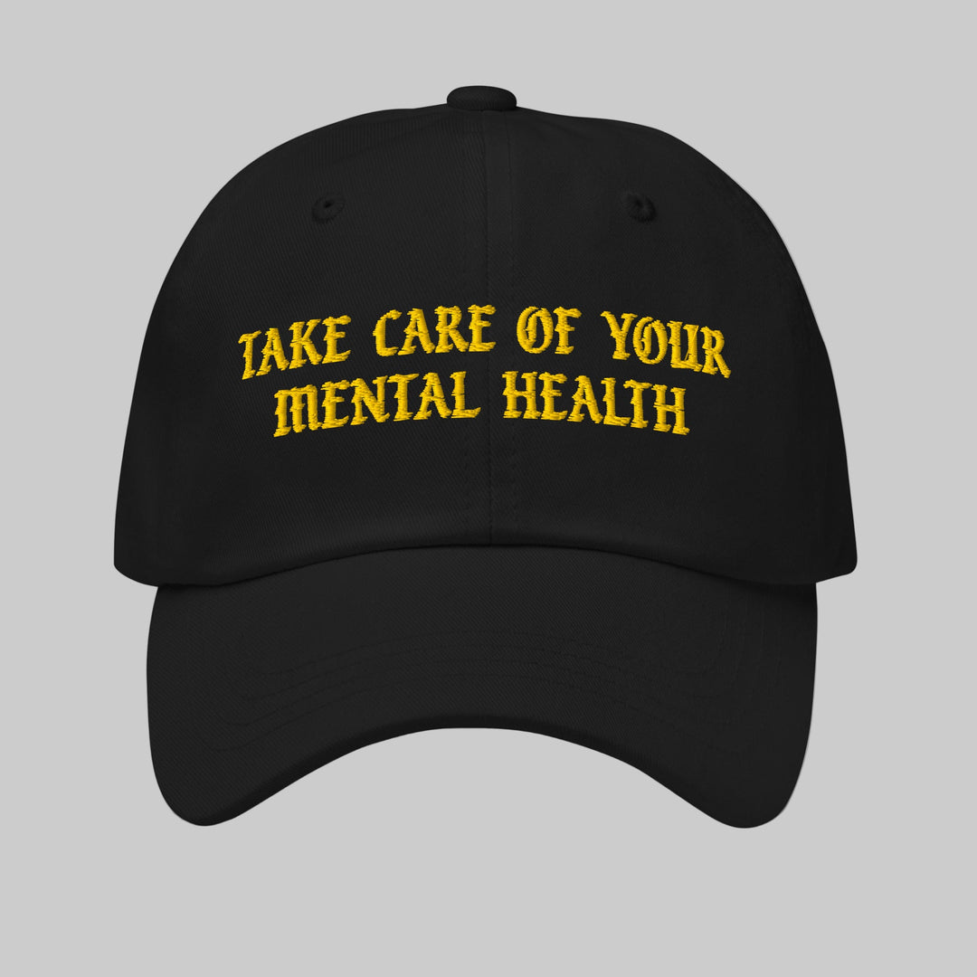 Black cap with yellow text 'Take Care of Your Mental Health' on a white background