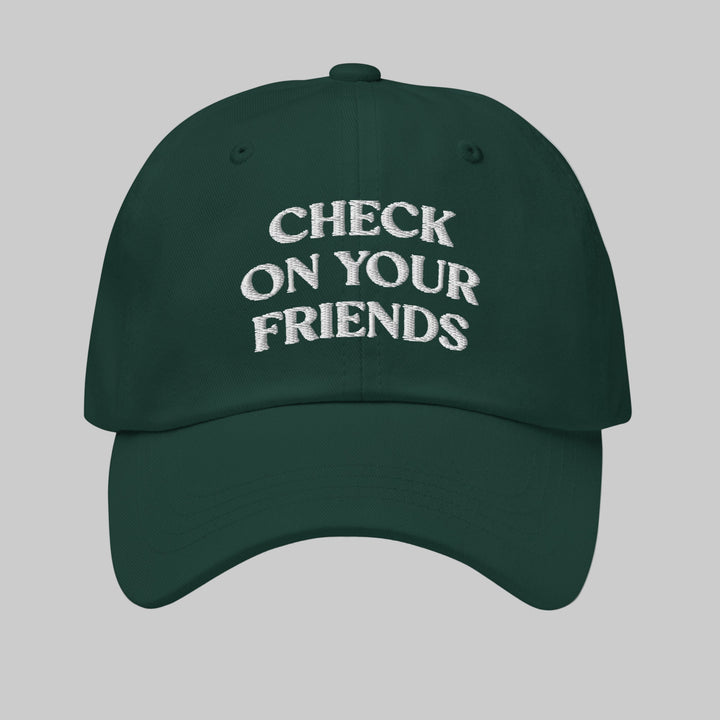 Green cap with 'Check on your friends' text on a white background