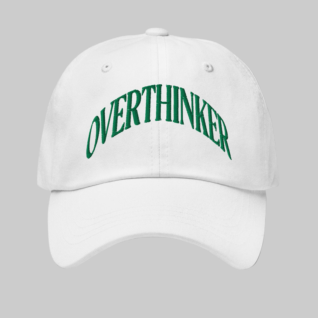 White cap with 'OVERTHINKER' text in green on a white background
