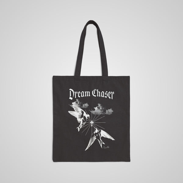 The Dream Chaser Graphic Tote Bag in black features an inspiring design, perfect for dreamers, teachers, and mental health advocates.