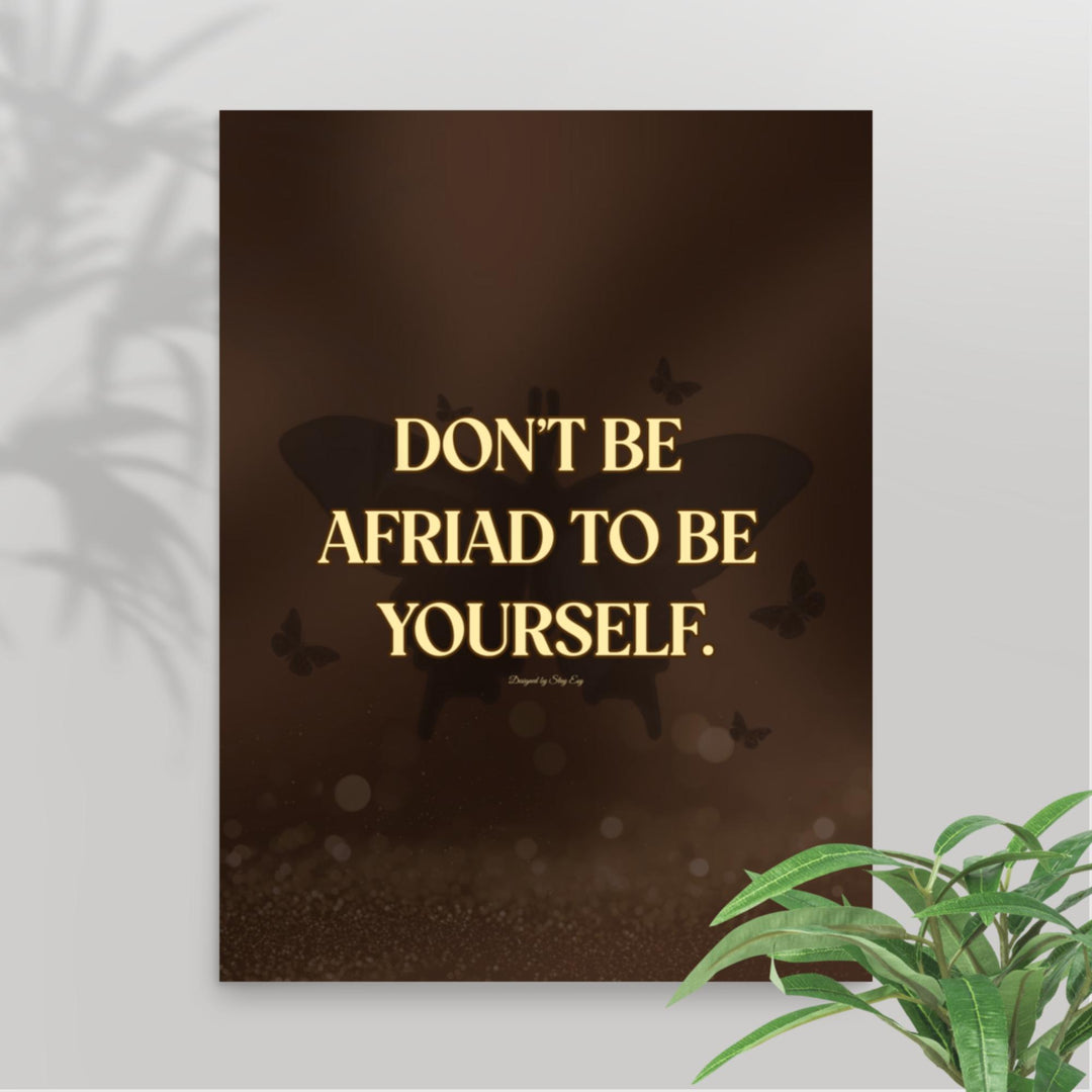 Poster with motivational quote 'Don't be afraid to be yourself' on a dark background with butterfly silhouettes.