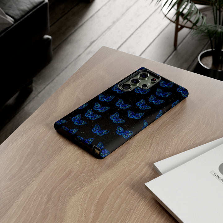  The Feeling Butterflies phone case in a real-life setting, showcasing its stylish butterfly design and protective build.
