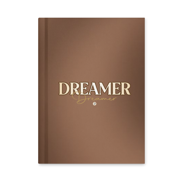 Brown notebook with 'Dreamer' text on a white background