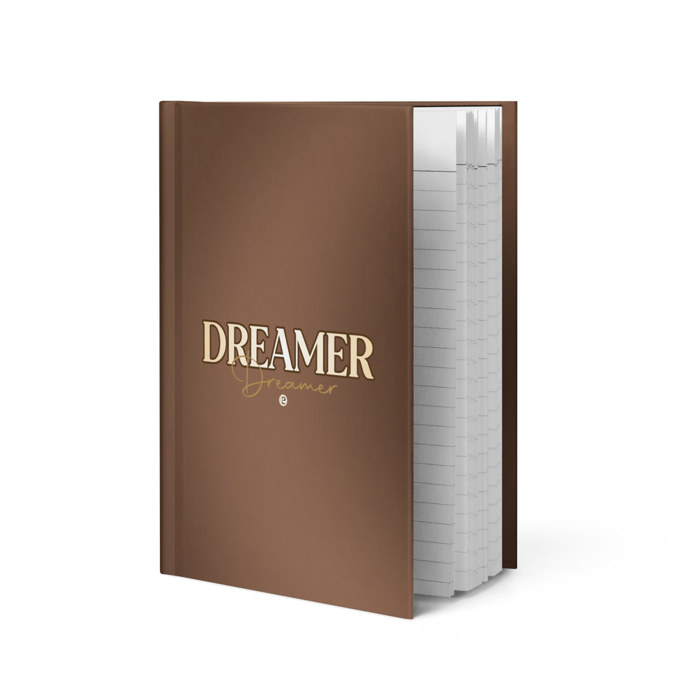 Brown notebook with 'Dreamer' text on a white background