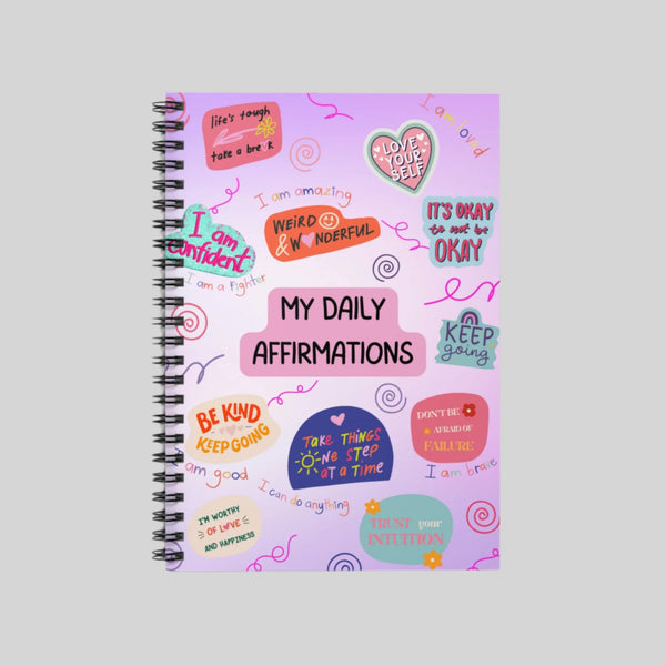 Mental Health Tracker Notebook, a guided mental health journal notebook to help track emotions, set goals, and practice daily affirmations.
