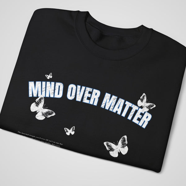 Close-up of Black trendy graphic sweatshirt – Featuring a motivational Mind Over Matter print.