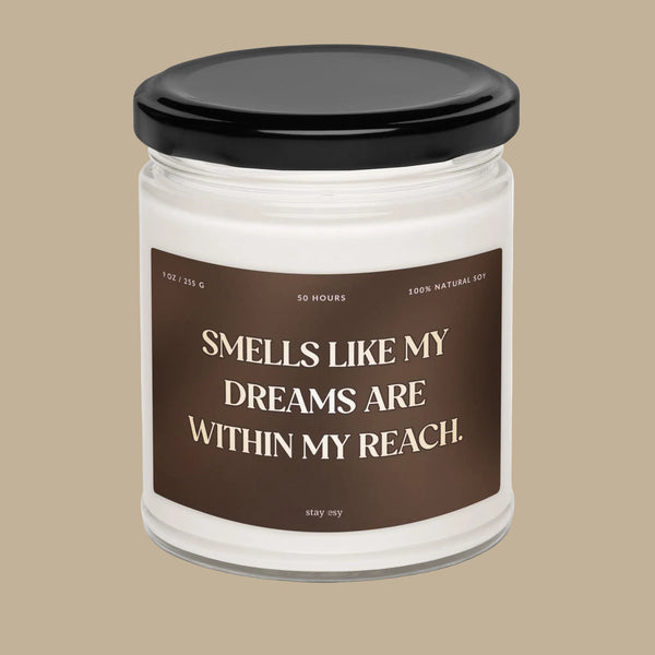 Candle jar with a brown label and black lid on a white background