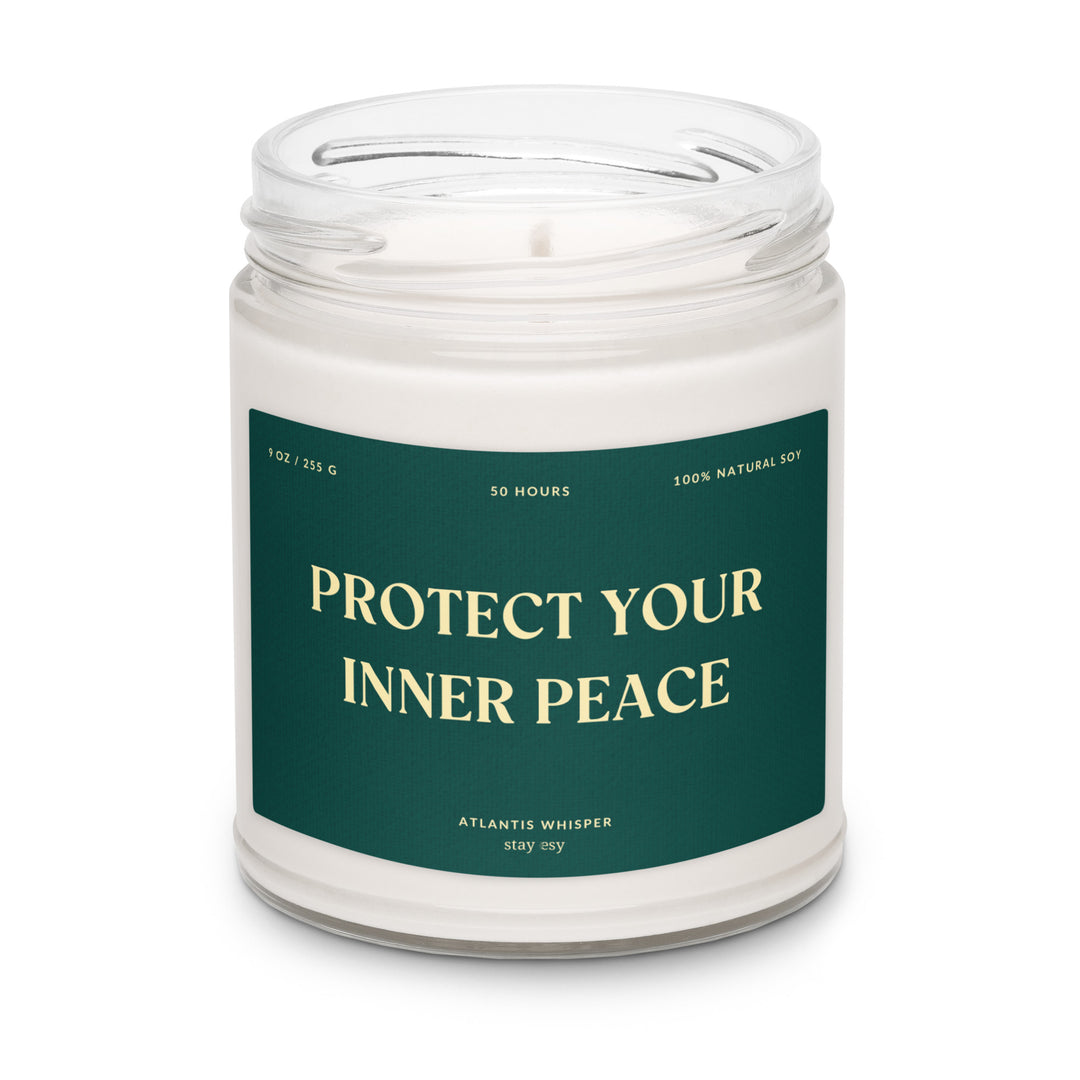 Candle in a jar with a green label reading 'Protect Your Inner Peace' on a white background