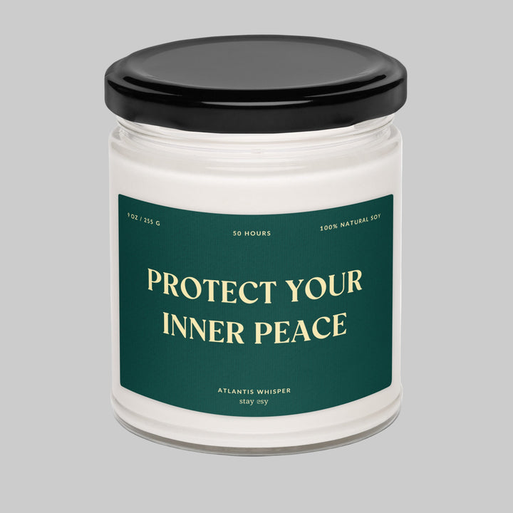Candle jar with a black lid and 'Protect Your Inner Peace' label on a white background