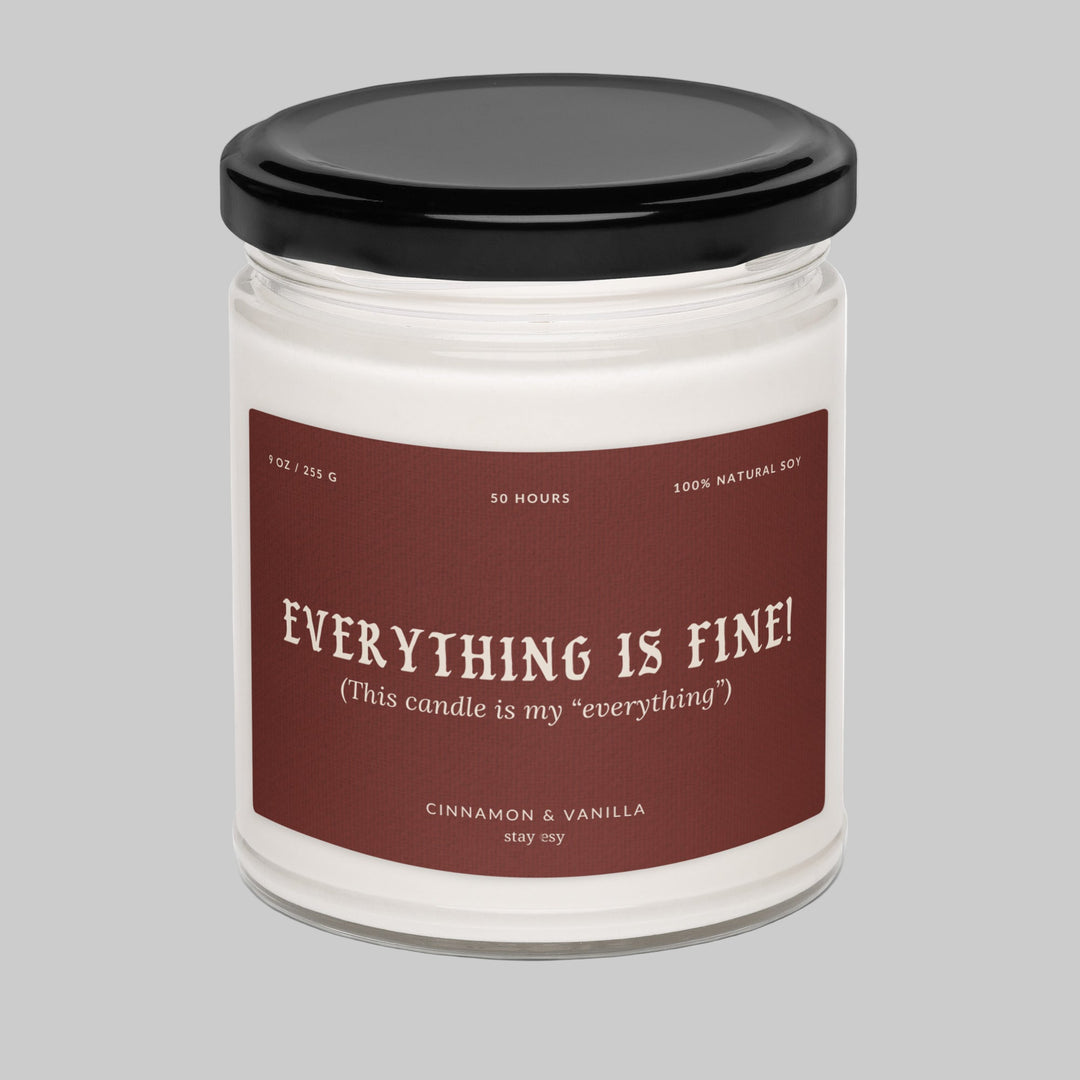Candle jar with a label reading 'Everything is fine!' on a white background