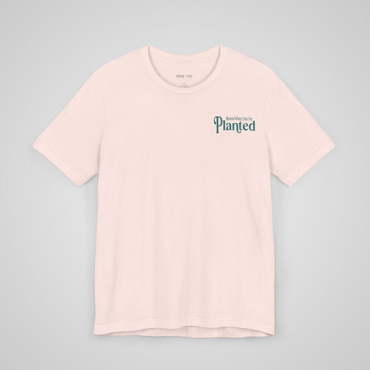 Front view of soft pink mental health apparel t-shirt with an uplifting message