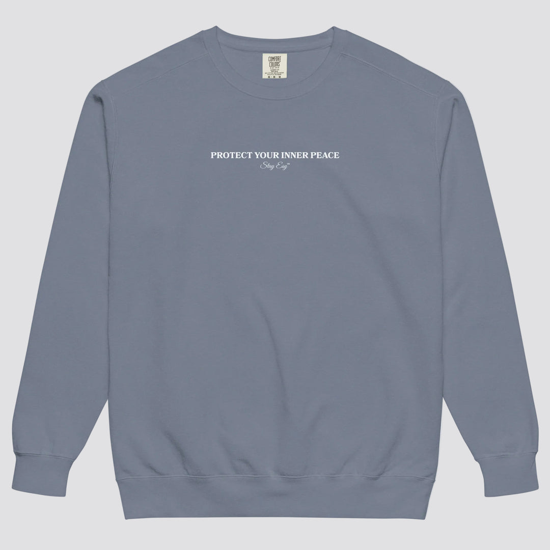 Blue Jean unisex sweatshirt small "Protect your inner peace"graphic text in the middle of chest with "Stay Esy" trademark in script font underneath.